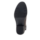 A top-down view of a dark brown boot's sole, showing a black rubber outsole with a ribbed heel and a side zipper, on a plain white background.