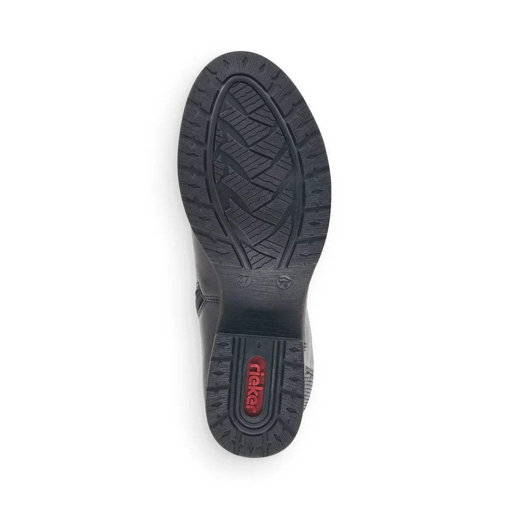 A top-down view of a black boot sole, showing the tread pattern and a red 'miker' brand logo on the heel, set against a plain white background.