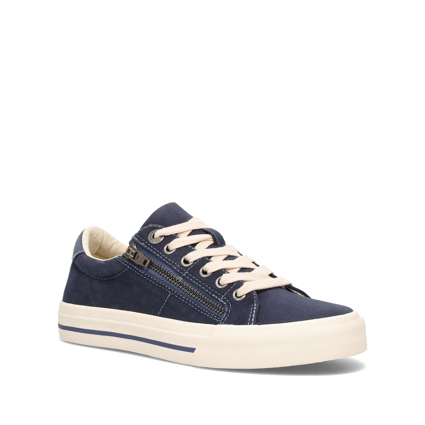 A navy blue low-top sneaker with a side zipper, cream-colored laces, and a thick cream-colored rubber sole, shown from a three-quarters angle on a white background.