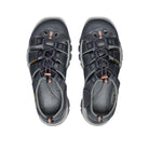 Pair of gray sandals with orange accents on a white background