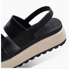 Black and beige sandal with a visible brand logo on a white background