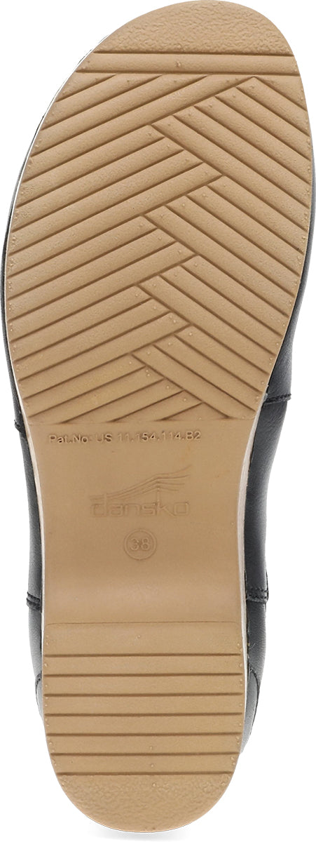 Close-up of the outsole of a shoe, showing a tan rubber tread with a herringbone pattern and embossed branding, with a dark upper partially visible at the sides.