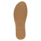 Tan shoe sole with textured surface on a white background