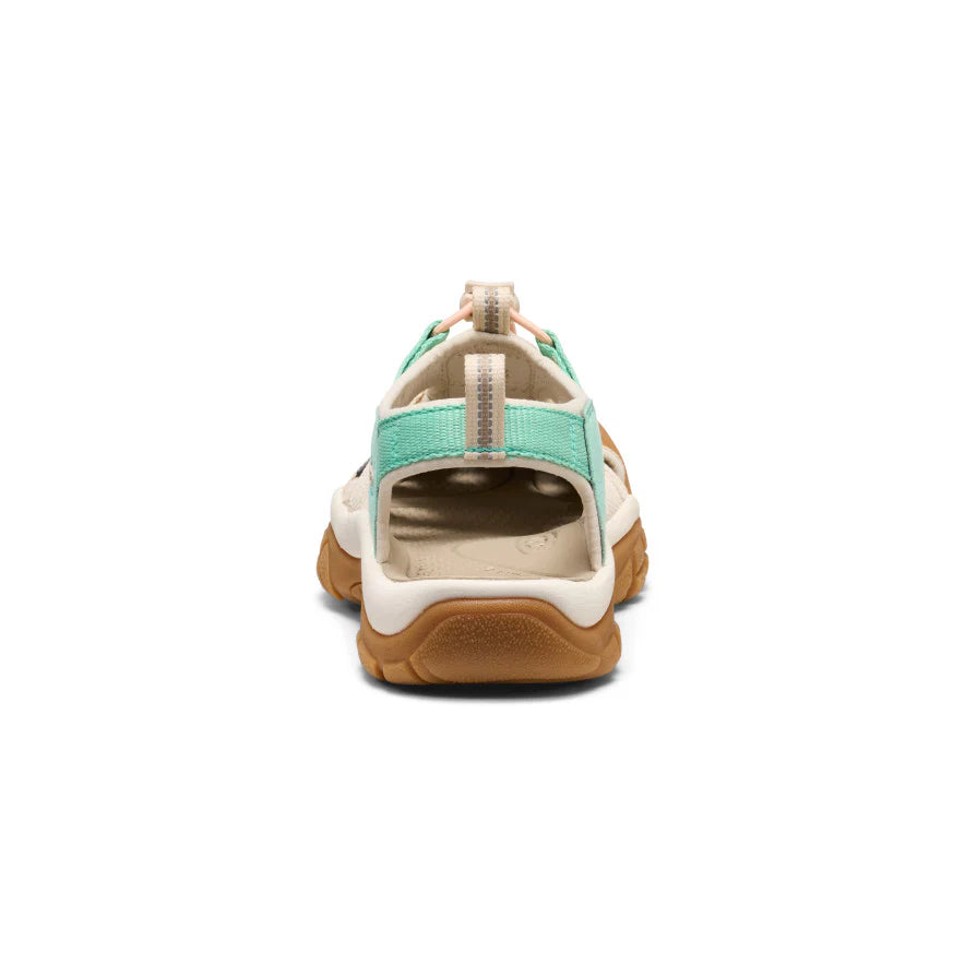 Back view of a sandal with green and brown design on a white background