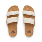 Pair of cork sandals with white straps on a white background, featuring the Reef logo.