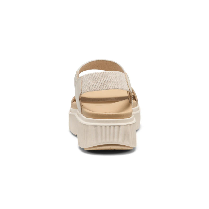 Beige sandal with a platform sole on a white background