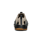 Sandal with beige and black design on a white background