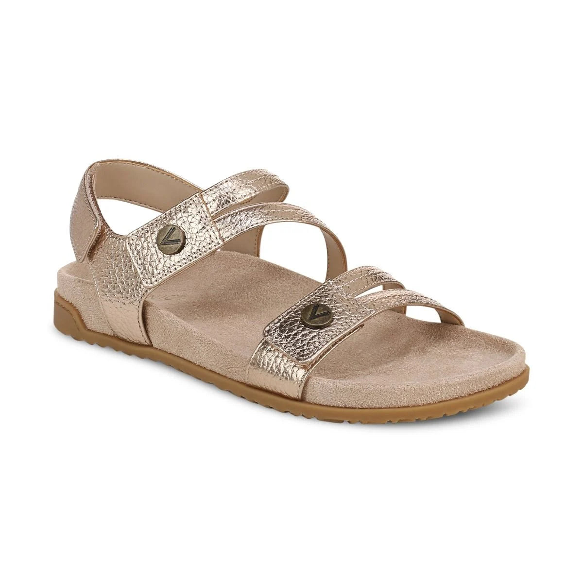 Beige sandal with metallic accents on a white background