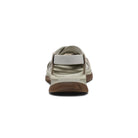 Beige sandal with brown sole on a white background