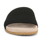 Black slide sandal with a beige sole on a white background