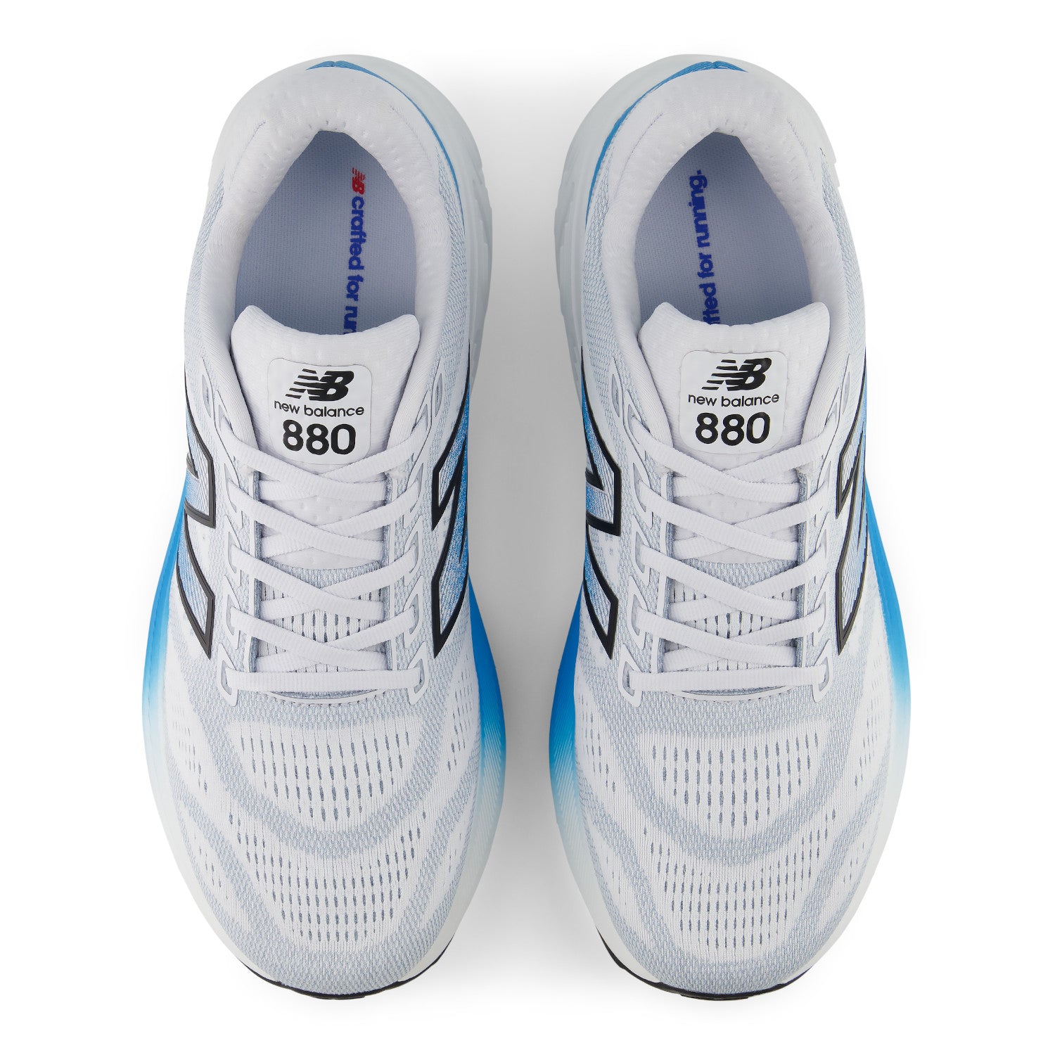 White New Balance 880 running shoes with blue accents on a white background