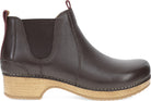 A dark brown leather Chelsea boot with a natural cork-look wedge heel, shown in a side profile view against a white background.