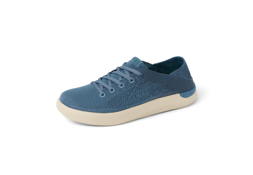 Blue sneaker with a white sole on a white background