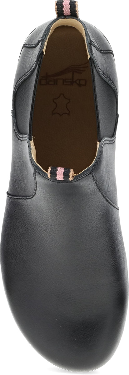 A black leather slip-on shoe by Daniko, shown from a top-down angle against a white background.