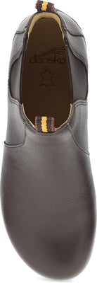 A dark brown leather slip-on shoe shown from a top-down angle, featuring elastic side cutouts and a small striped pull tab near the opening.