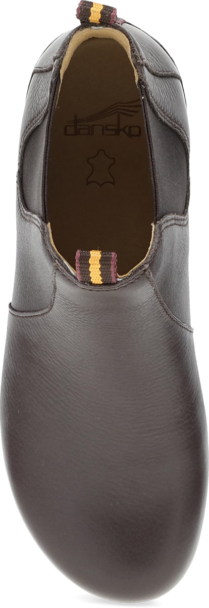 A dark brown leather slip-on shoe shown from a top-down angle, featuring elastic side cutouts and a small striped pull tab near the opening.