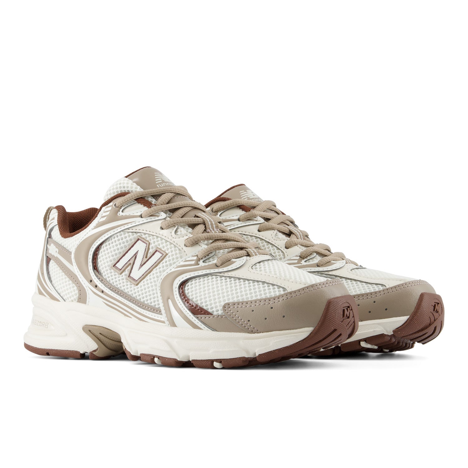 A pair of New Balance 530 running shoes in beige, white, and brown, shown from a three-quarters angle on a white background.