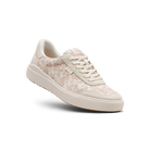White sneaker with floral pattern on a white background