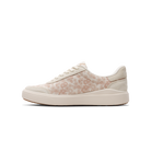 Beige sneaker with subtle pattern on a white background