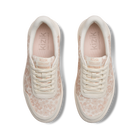 Pair of cream sneakers with subtle pattern on a white background