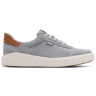 Gray sneaker with brown heel tab on a white background