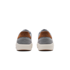 Gray sneakers with brown accents and 'kizik' branding on a white background