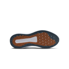 Close-up of a shoe sole with brown and blue tread pattern on a white background
