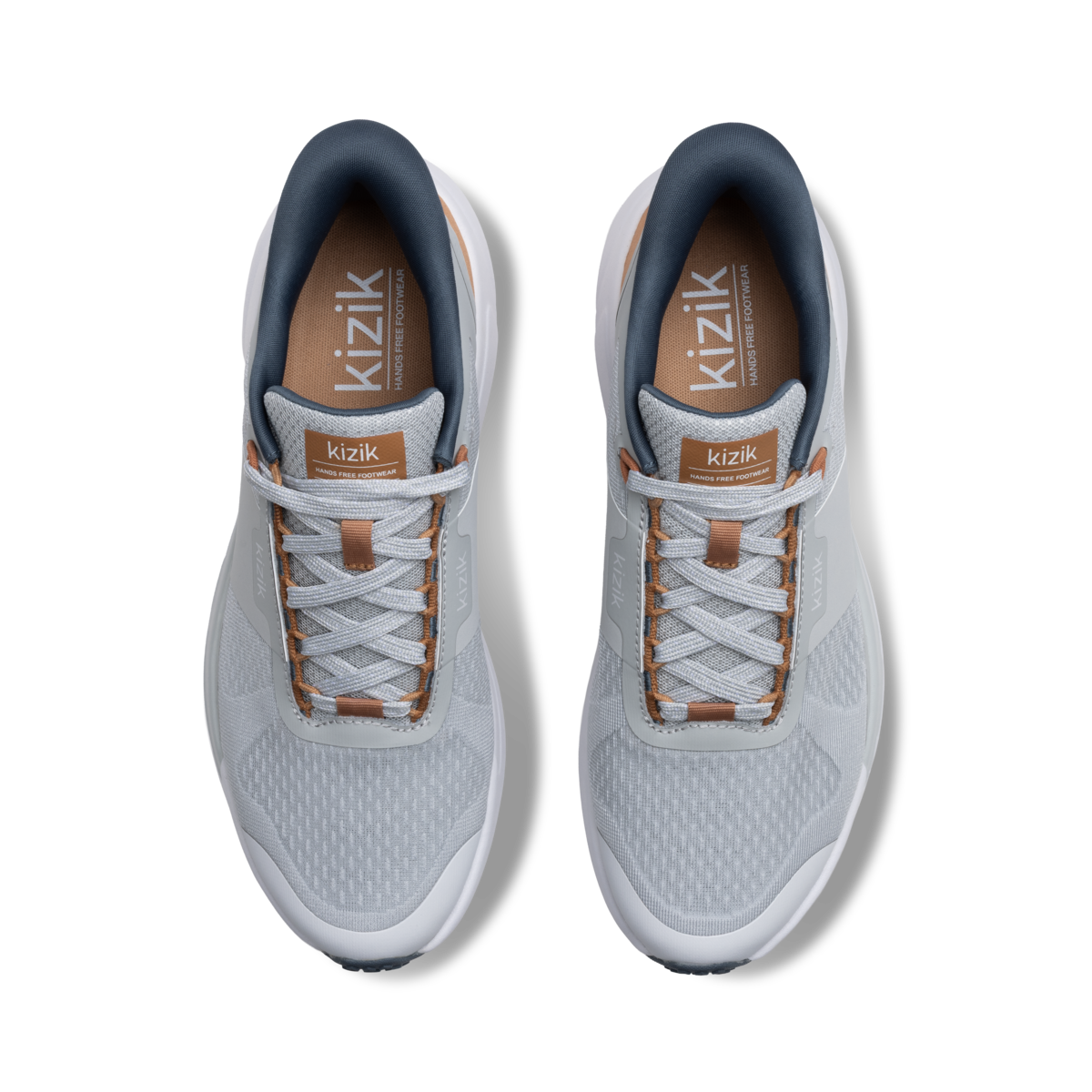 Pair of gray sneakers with brown accents on a white background