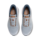 Pair of gray sneakers with brown accents on a white background