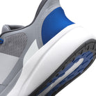 Close-up of a gray and blue athletic shoe with a white sole.