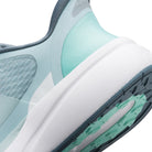 Close-up of a sneaker with light blue and gray design on a white background