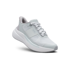 Gray athletic shoe with brown accents on a black background