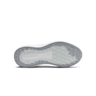 Top view of a shoe sole with a textured pattern on a black background