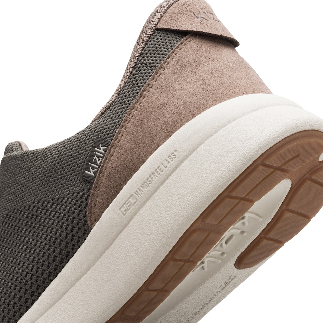 Brown and black sneaker with white sole on a white background