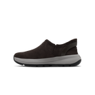 Brown slip-on shoe with white sole on a black background
