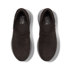 A pair of dark brown slip-on shoes with a suede-like finish, shown from a top-down view on a white background. The brand name 'kizik' is printed in white on the inner sole of each shoe.
