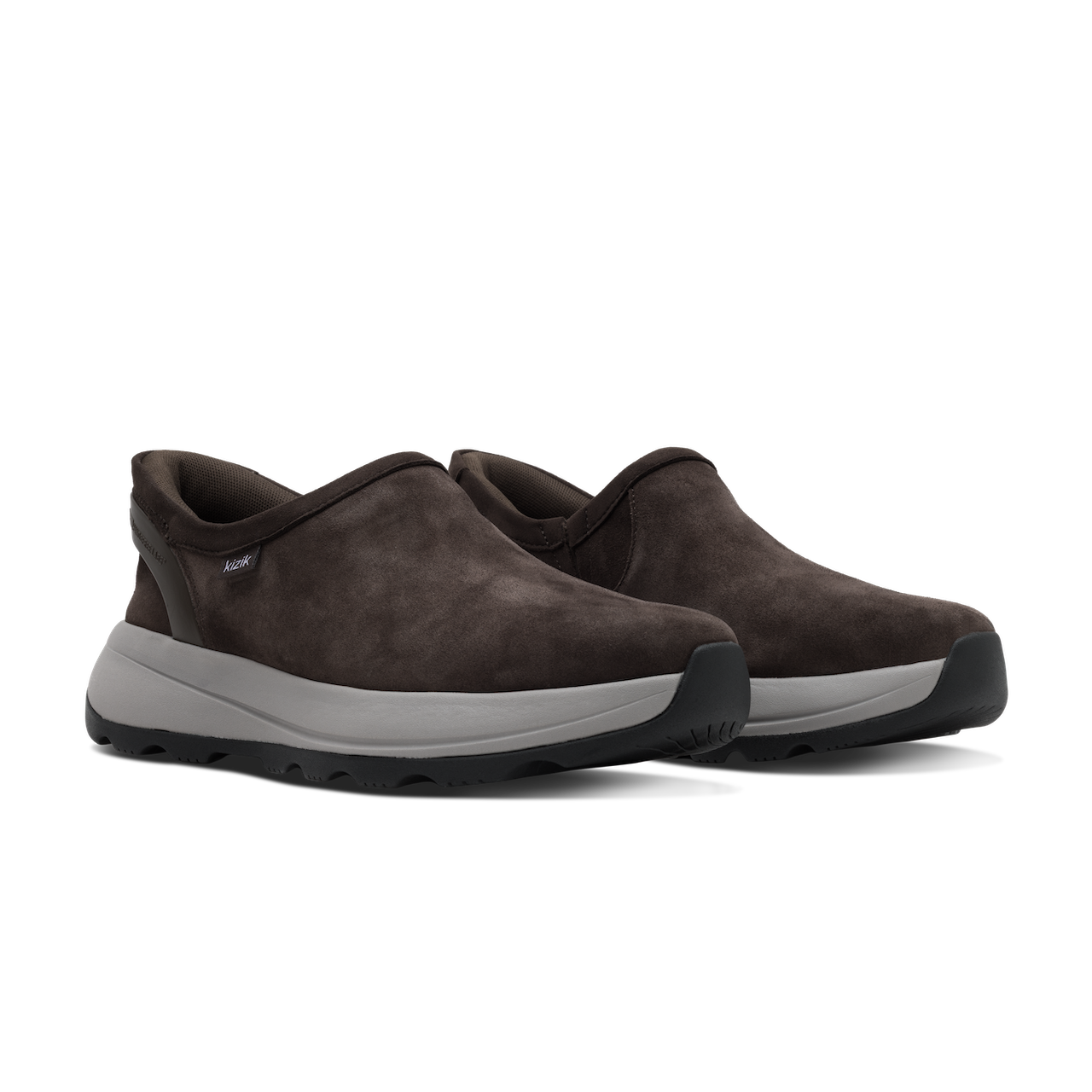 Pair of brown slip-on shoes with gray soles on a white background