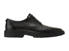 Black patent leather shoe with gold accents on a white background