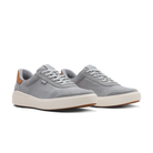 Pair of white sneakers with a subtle pattern on a white background