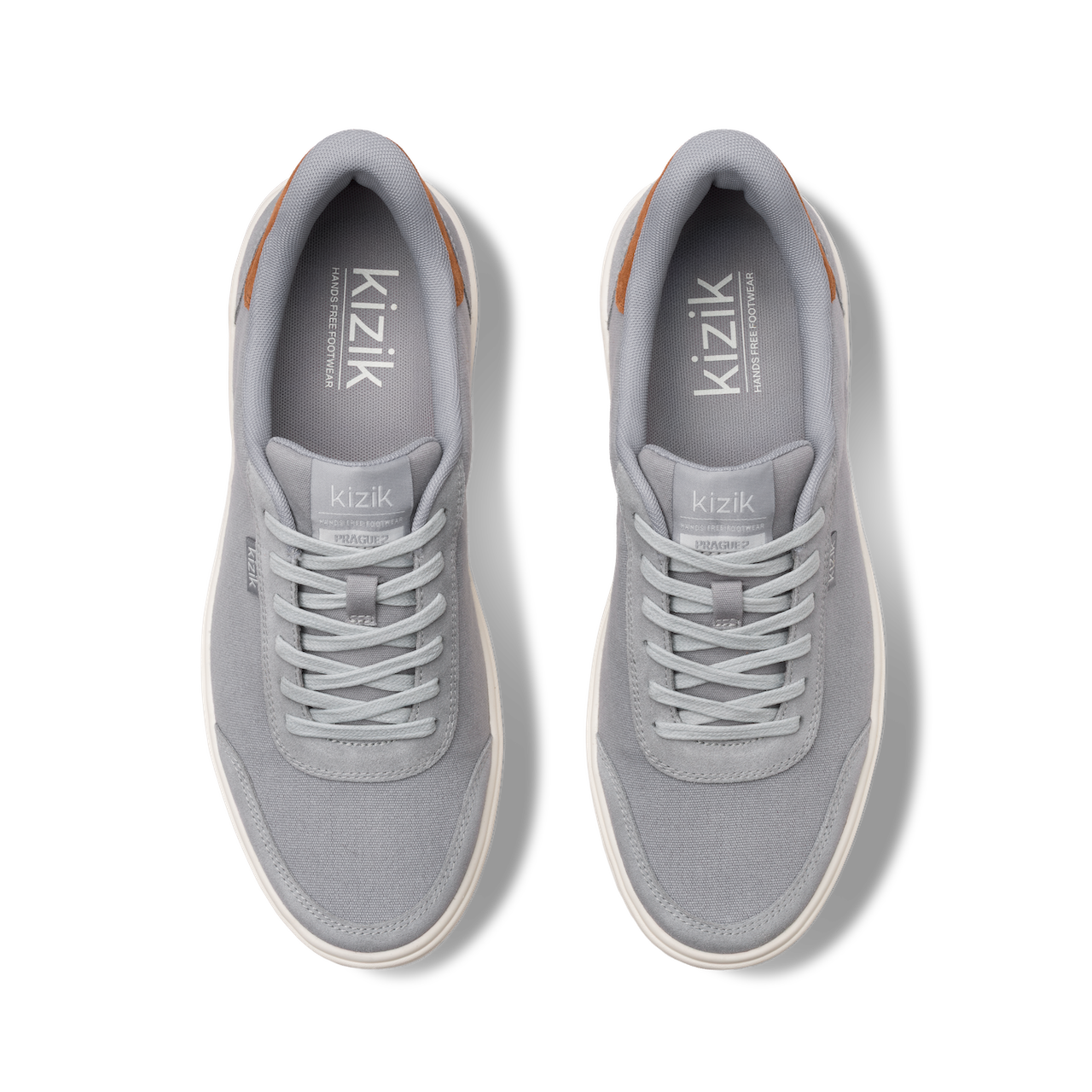 Pair of gray sneakers with 'kizik' branding on a white background