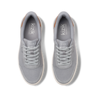 Pair of gray sneakers with 'kizik' branding on a white background