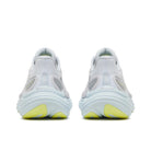 White sneakers with yellow accents on a white background