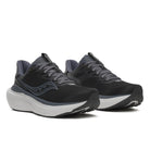 Pair of black and gray running shoes on a white background