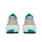 A pair of Saucony athletic sneakers shown from the back, featuring a light gray mesh upper, white chunky midsoles, and bright teal accents on the collar lining, outsole, and heel.
