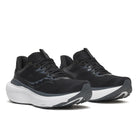 A pair of black running shoes with a thick white and dark gray sole, shown from a three-quarters angle on a white background.