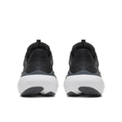 A pair of black and dark gray athletic sneakers shown from the back, featuring chunky white midsoles and dark gray outsoles, set against a plain white background.