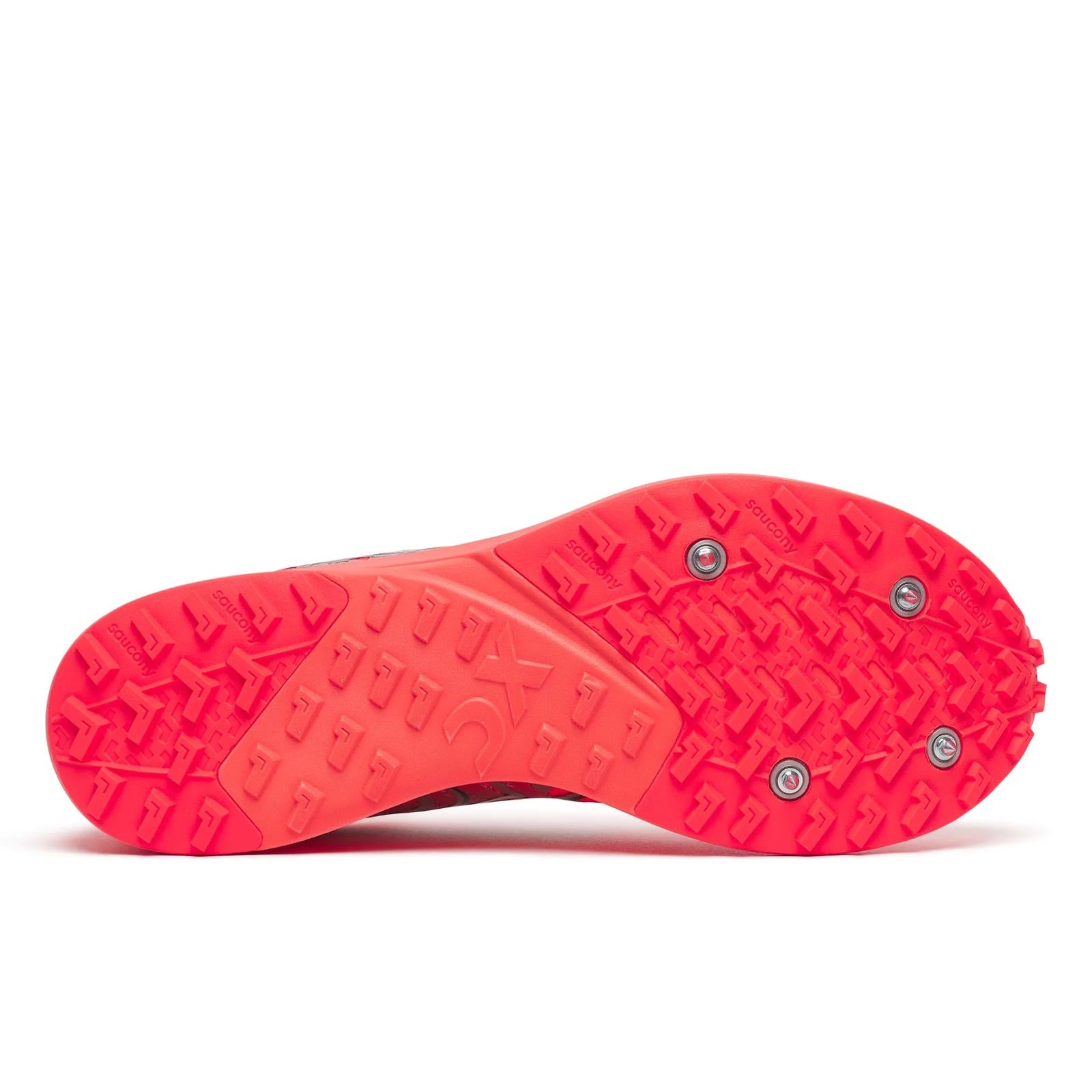 Close-up of a red athletic shoe sole with tread pattern on a white background