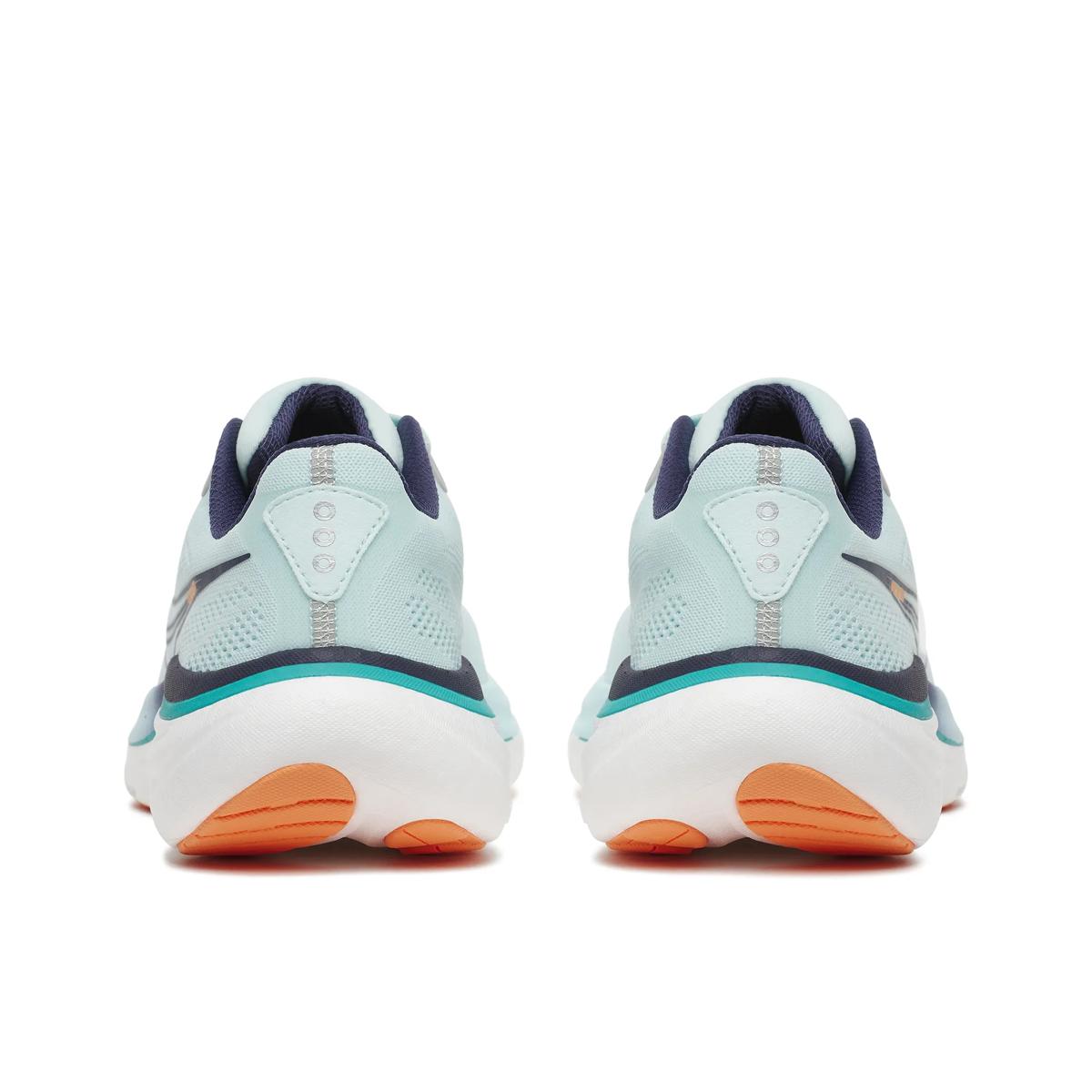 Light blue running shoes with orange accents on a white background