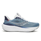 Blue running shoe with white sole on a white background