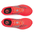 Pair of red running shoes with orange laces on a white background